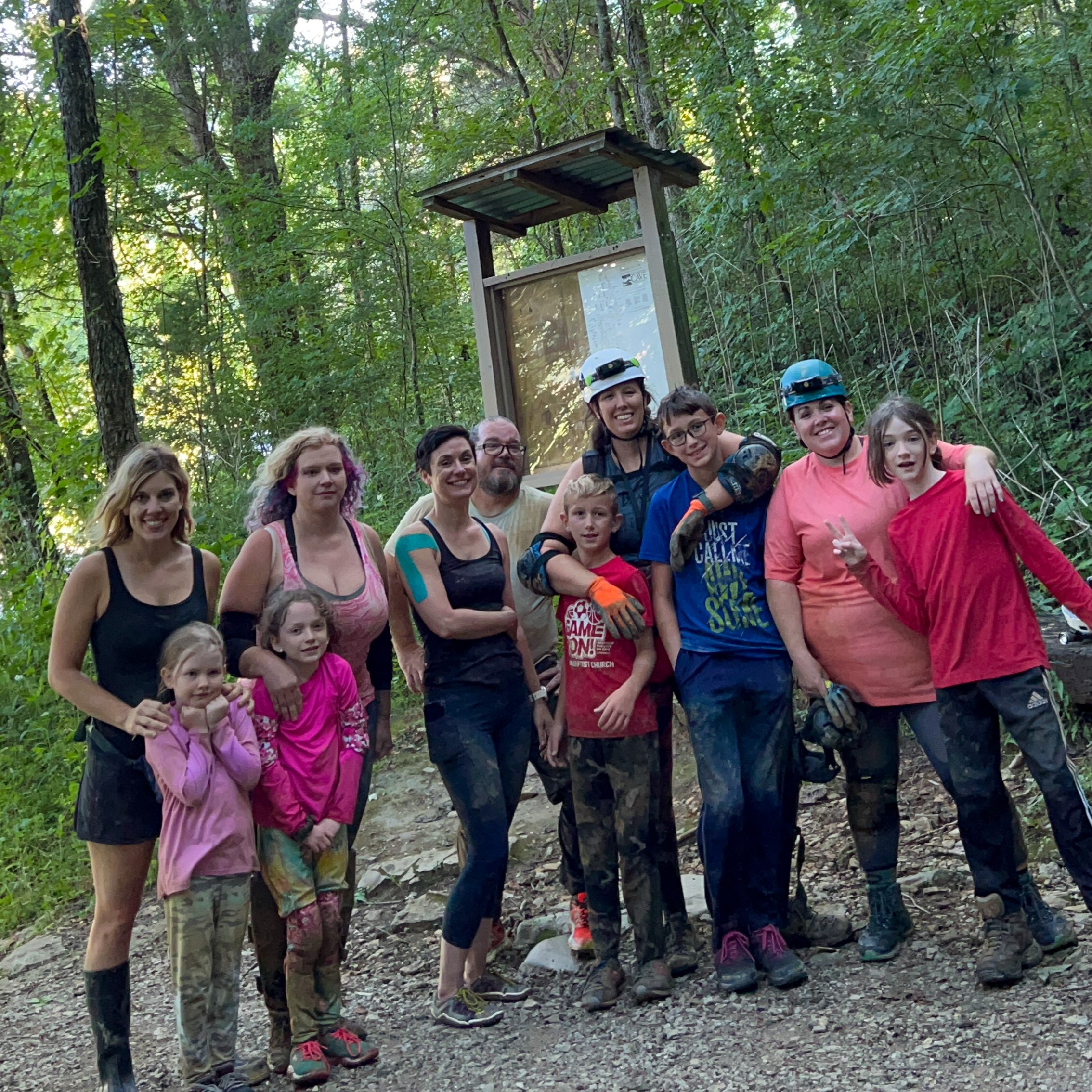 photo of group posting outside of cave kiosk